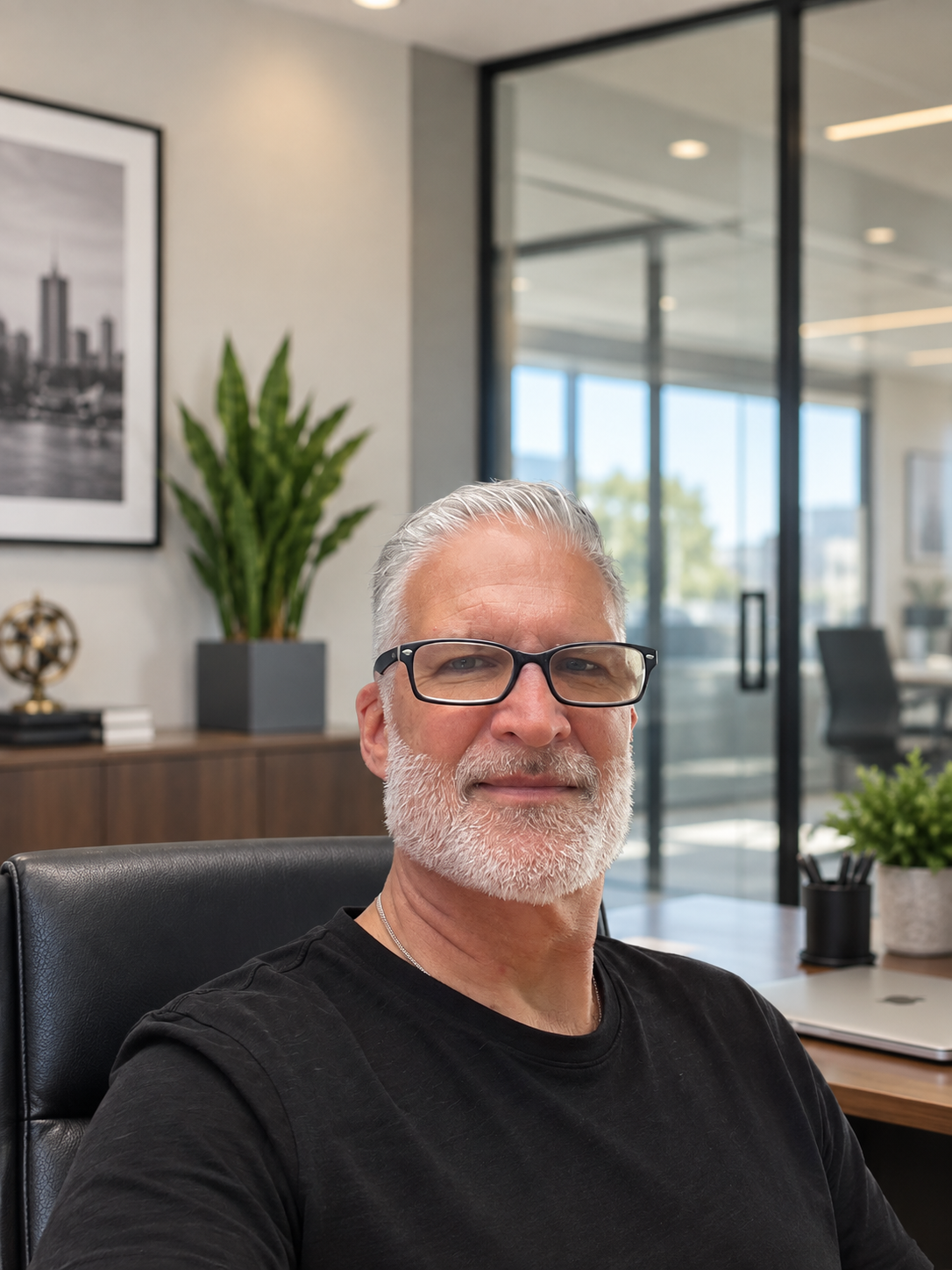 Christopher seated in his office